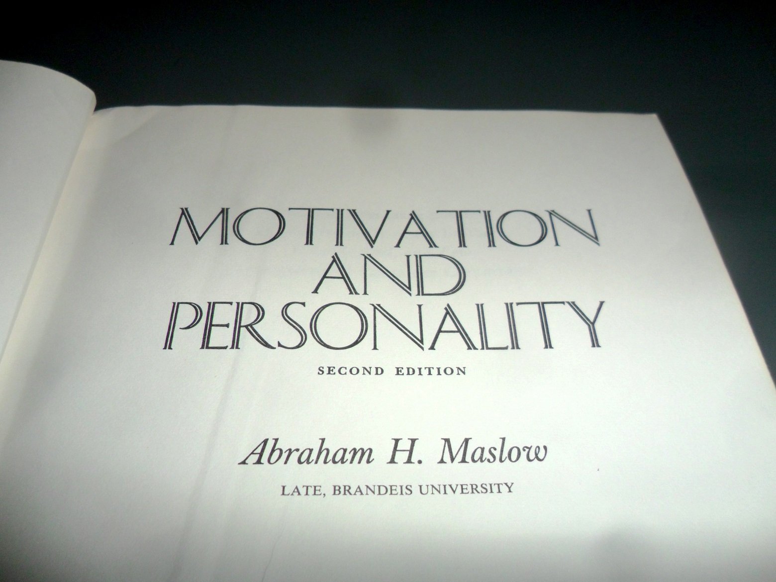 The first page of Motivation and Personality with a description of Maslow's pyramid